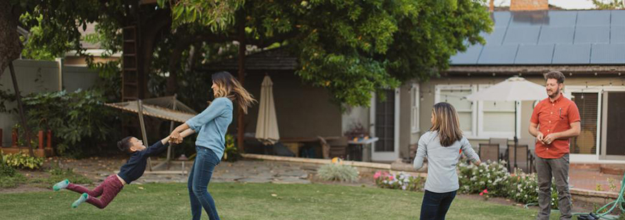 Family playing in backyard