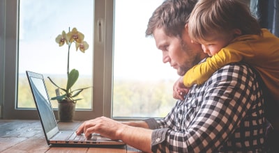 man with computer and sone